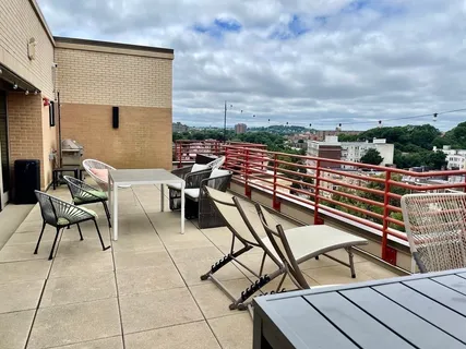 a view of a terrace with furniture