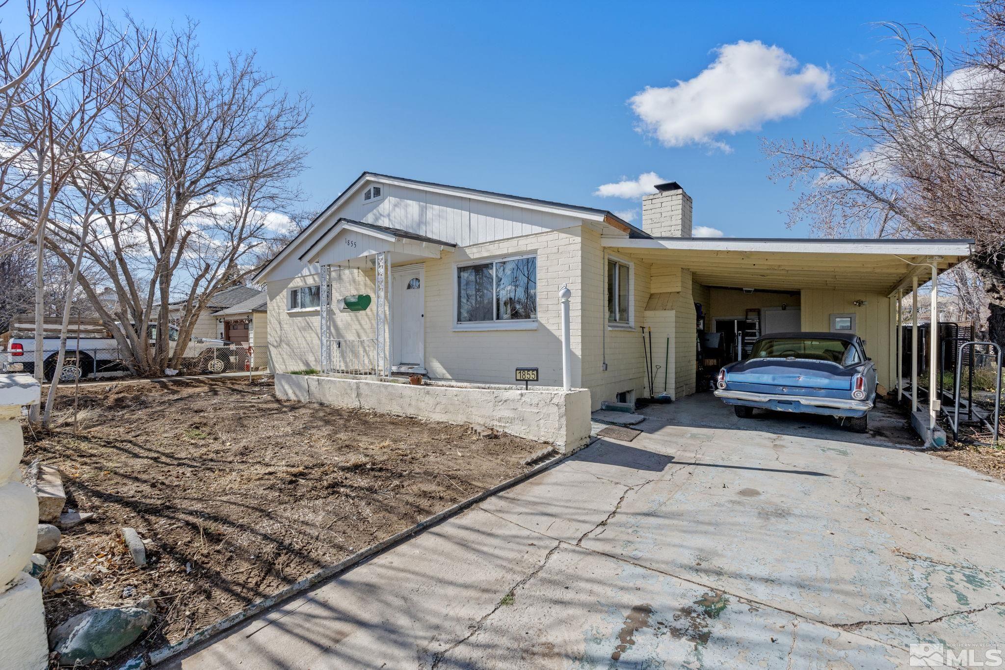 1855 Desna Street Reno, NV 89512 - Photo 1 of 35 a view of a house with a snow in the yard