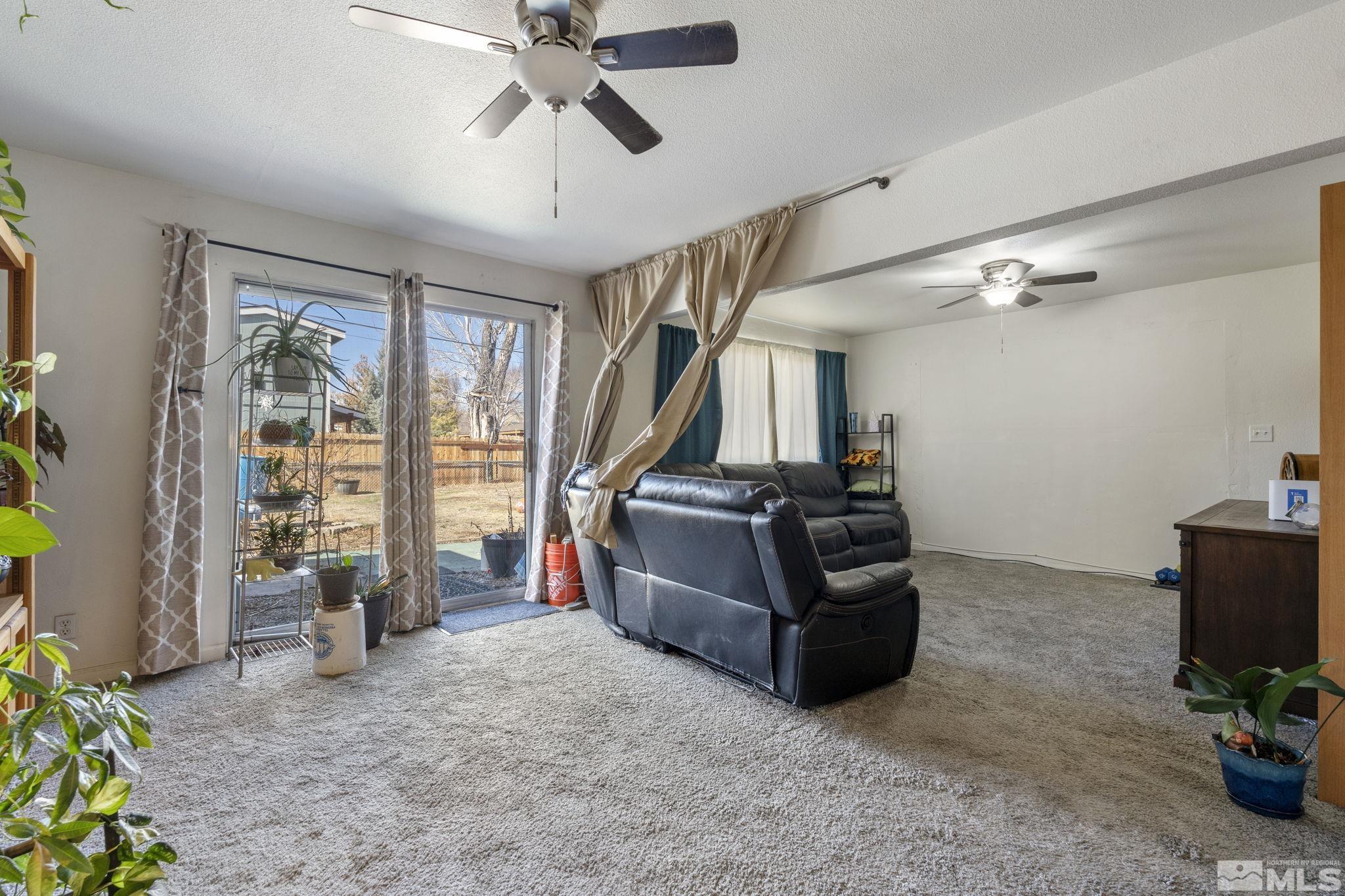 1855 Desna Street Reno, NV 89512 - Photo 15 of 35 a living room with furniture and a flat screen tv