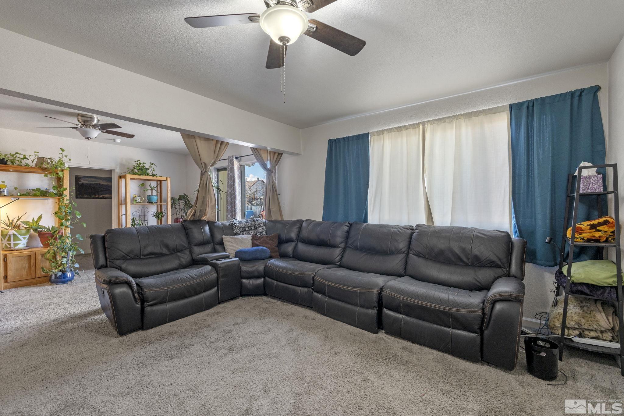 1855 Desna Street Reno, NV 89512 - Photo 28 of 35 a living room with furniture and a large window