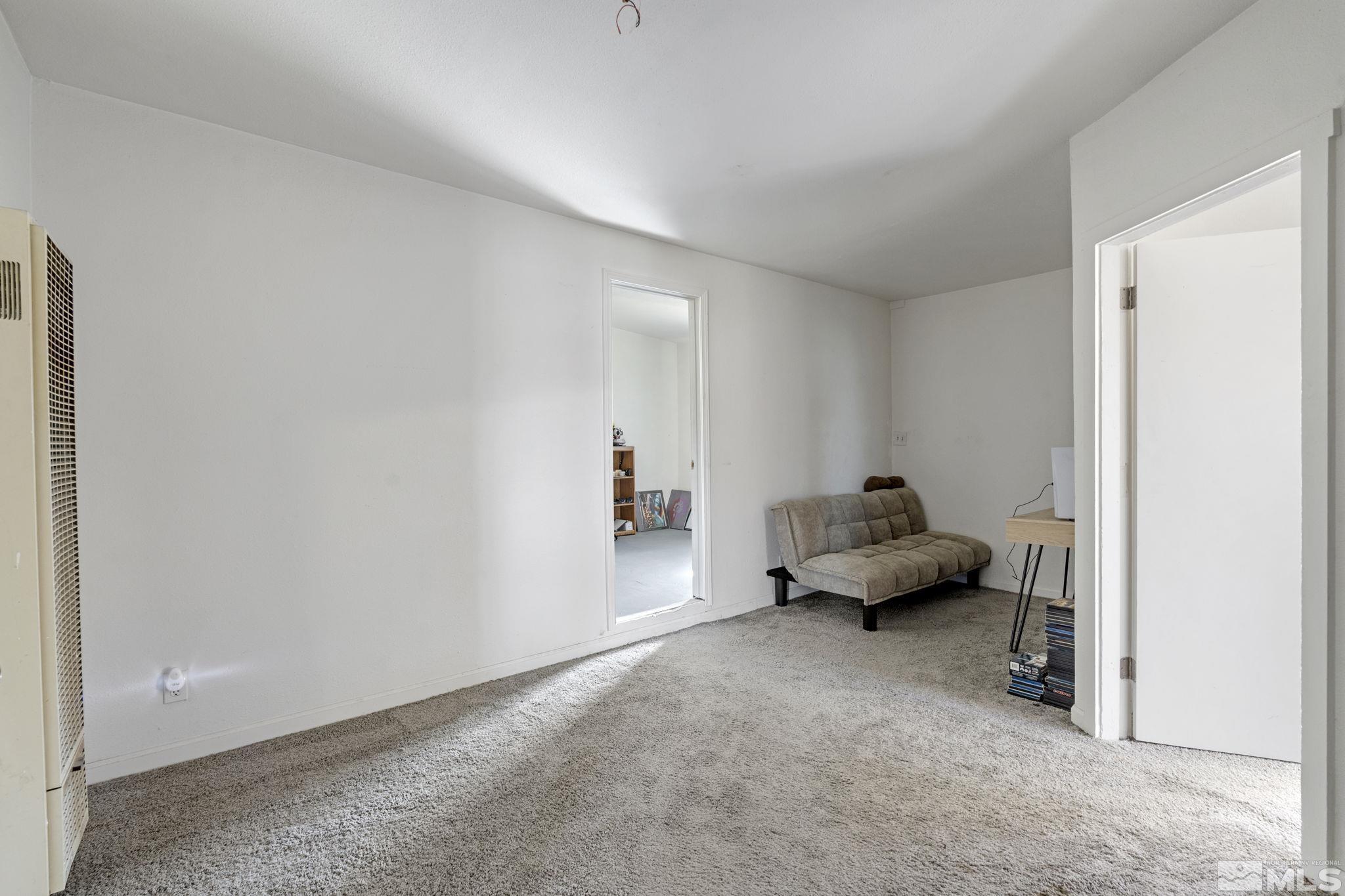 1855 Desna Street Reno, NV 89512 - Photo 30 of 35 a living room with furniture and a window