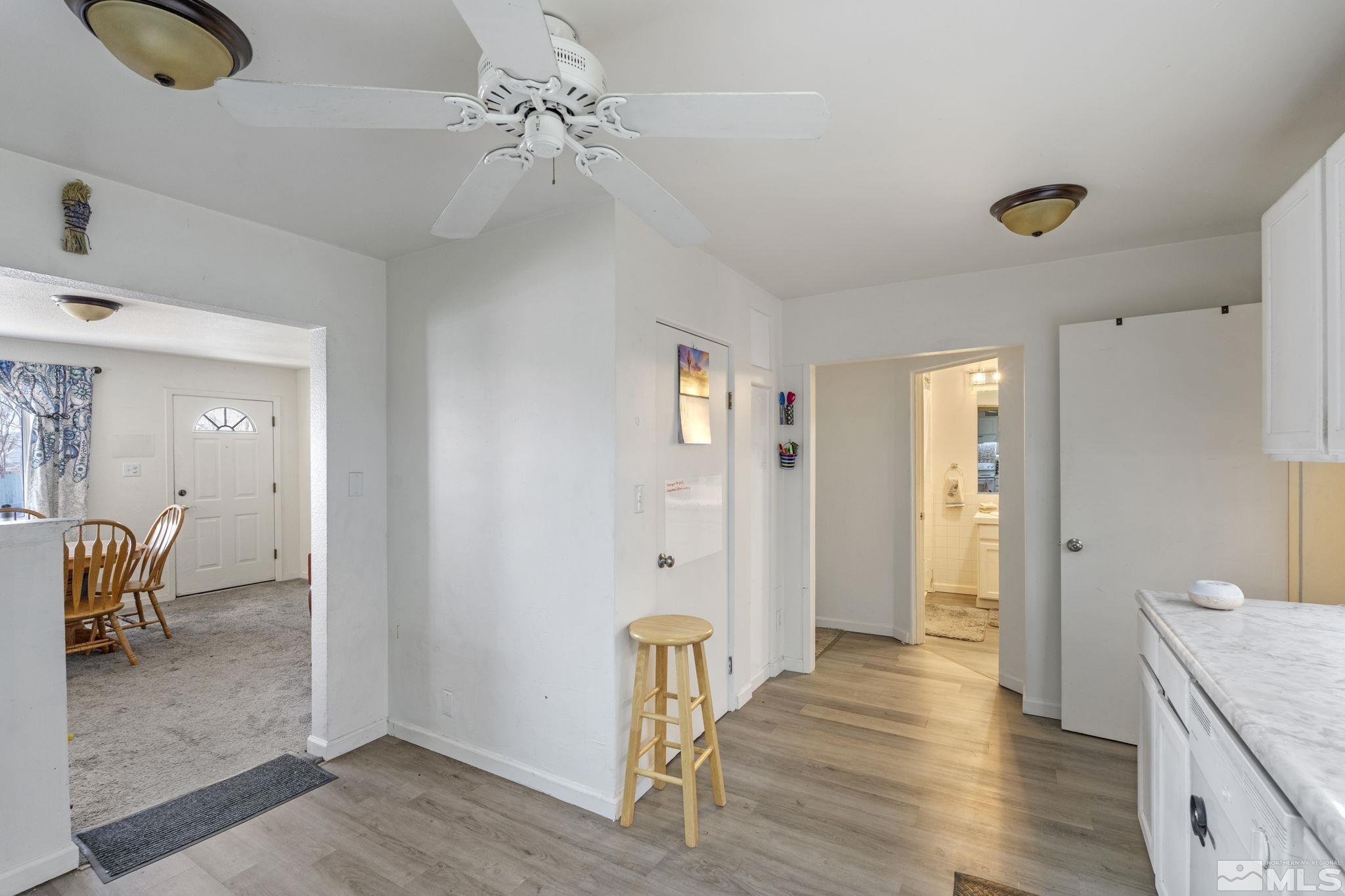 1855 Desna Street Reno, NV 89512 - Photo 8 of 35 a view of a hallway with wooden floor and workspace