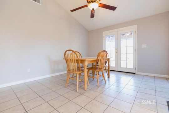 620 East Wilson Avenue Ridgecrest, CA 93555 - Photo 13 of 30 a view of a dining room with furniture and chandelier