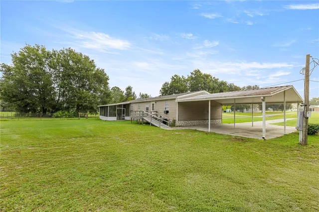 a view of a house with a big yard
