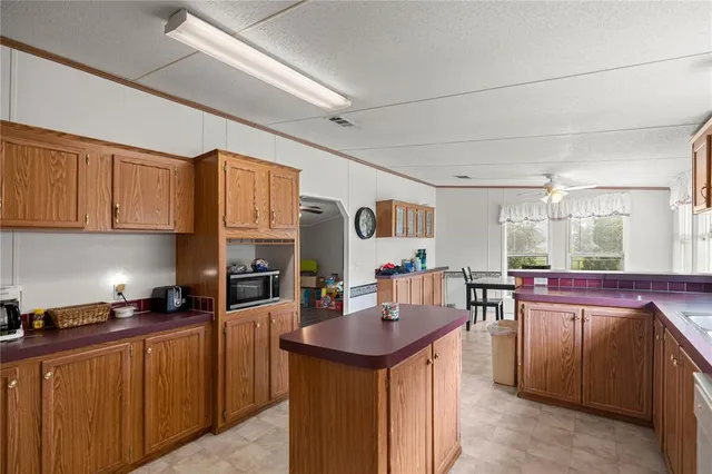 a kitchen with cabinets a sink and appliances