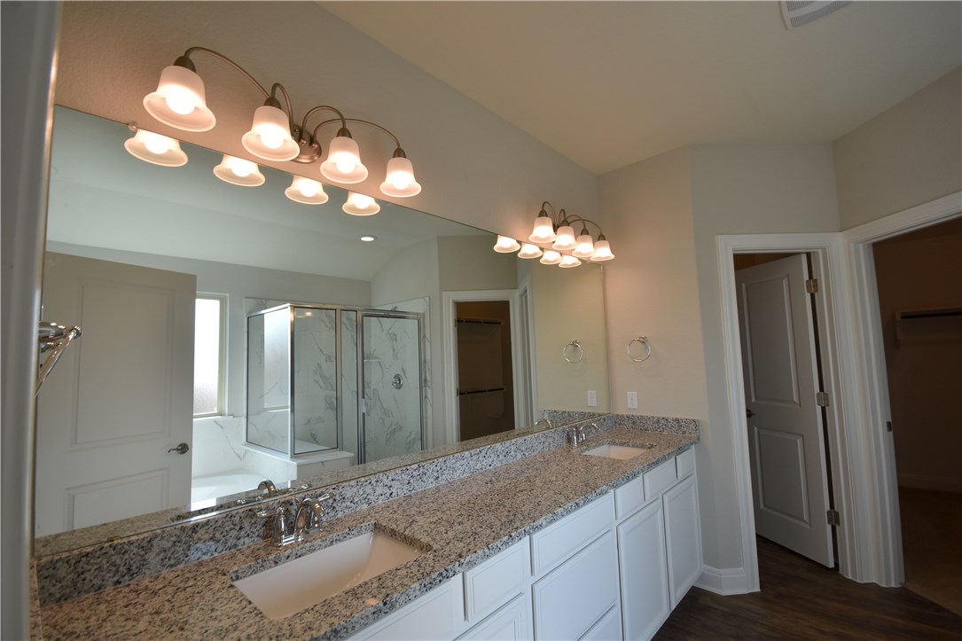 15911 Cessida Street Austin, TX 78728 - Photo 13 of 22 Master Bath with Dual Granite Vanities, Separate Tub/Shower.