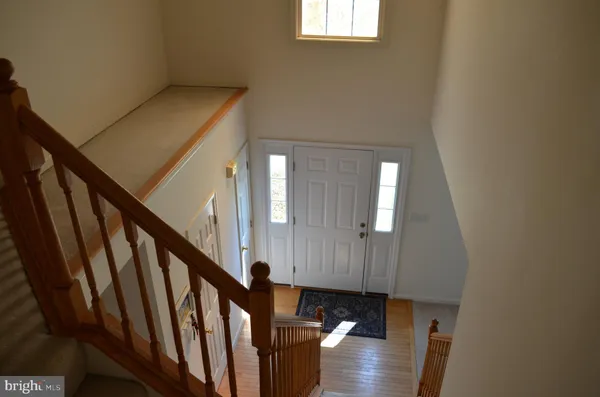 a view of entryway with wooden floor