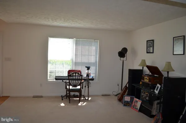 a work room with furniture and windows