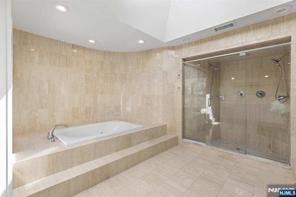 1 Hemlock Drive Cresskill, NJ 07626 - Photo 17 of 26 a bathroom with a tub and shower