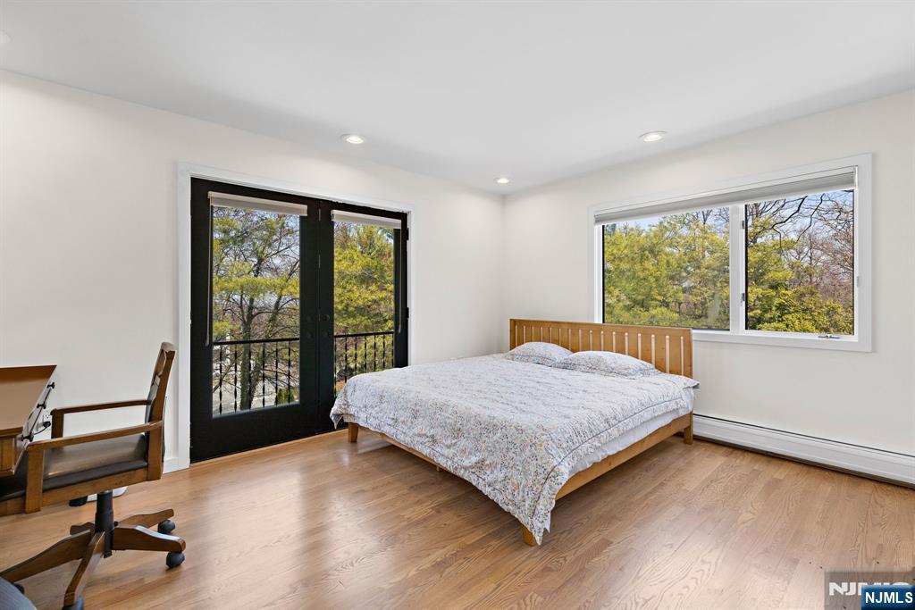 1 Hemlock Drive Cresskill, NJ 07626 - Photo 19 of 26 a bedroom with a large bed and a large window