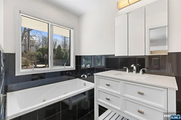 a bathroom with a sink and a bathtub