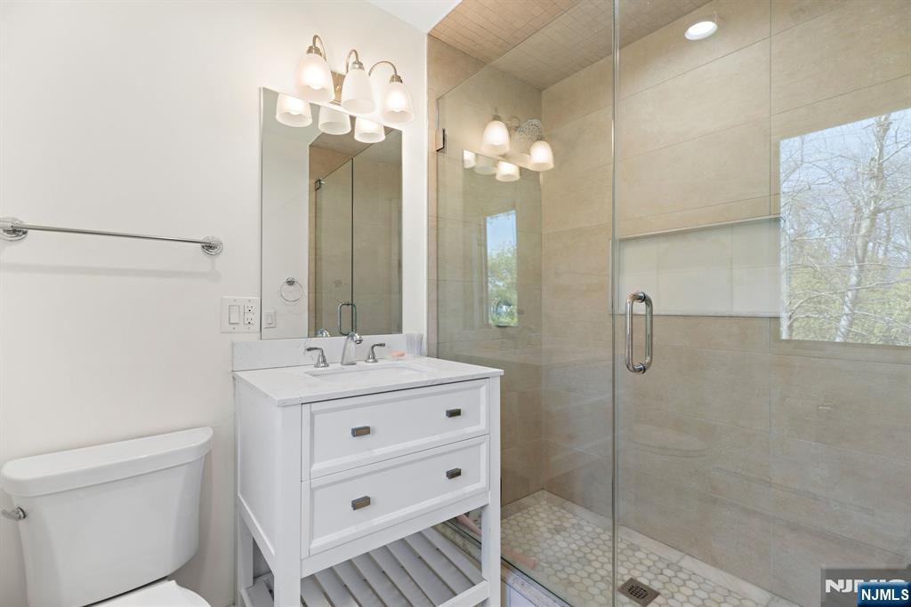 1 Hemlock Drive Cresskill, NJ 07626 - Photo 26 of 26 a bathroom with a double vanity sink mirror and shower