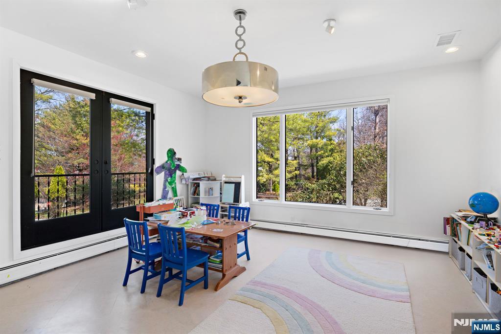 1 Hemlock Drive Cresskill, NJ 07626 - Photo 6 of 26 a view of a dining room with furniture window and outside view