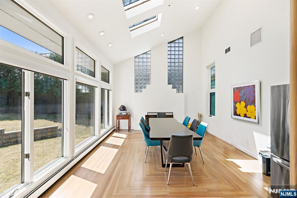 1 Hemlock Drive Cresskill, NJ 07626 - Photo 8 of 26 a dining room with furniture and a floor to ceiling window