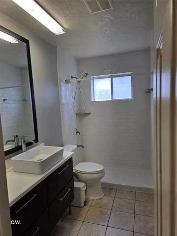 a bathroom with a sink toilet and mirror