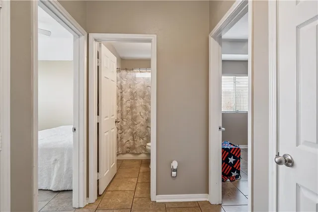 a view of a bathroom from a hallway