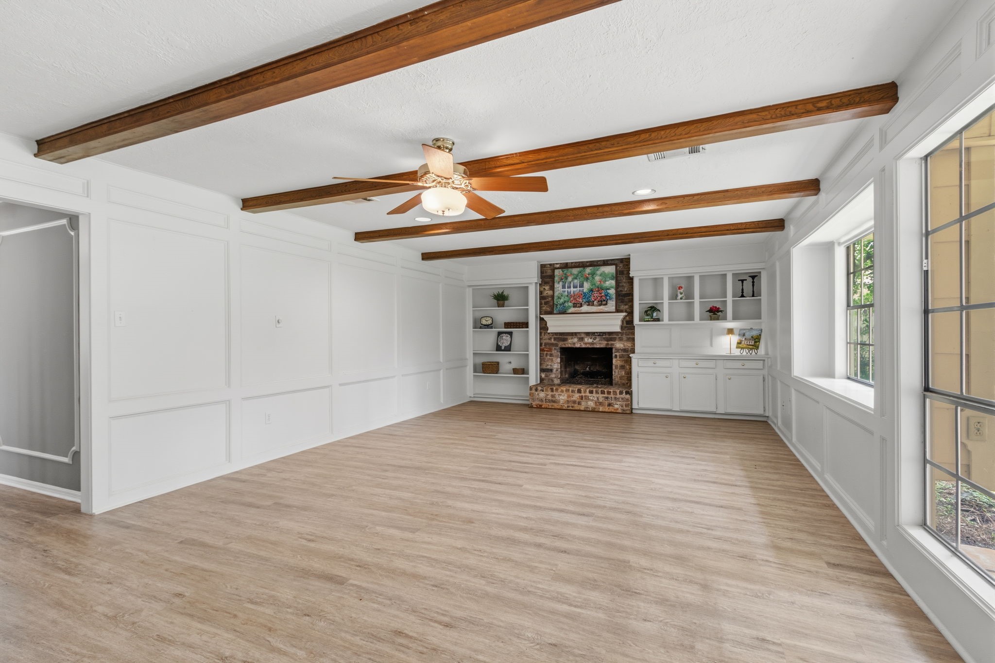 3422 Candlewisp Drive Spring, TX 77388 - Photo 10 of 50 FAMILY ROOM - Painted block paneling and wood beams in the ceiling give this room a custom feel.