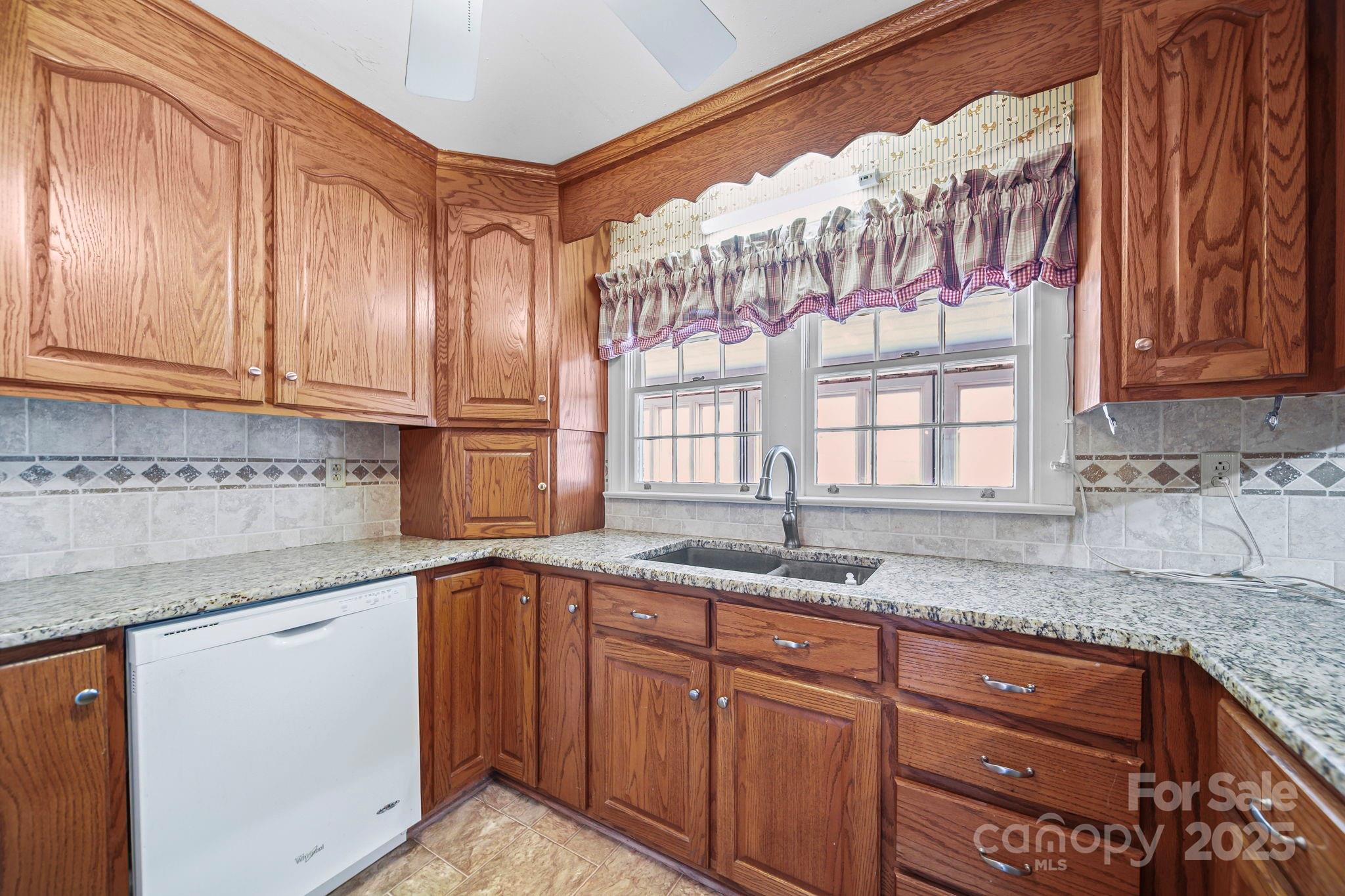 1223 Walker Road Mount Pleasant, NC 28124 - Photo 14 of 48 a kitchen with granite countertop stainless steel appliances a sink and a window