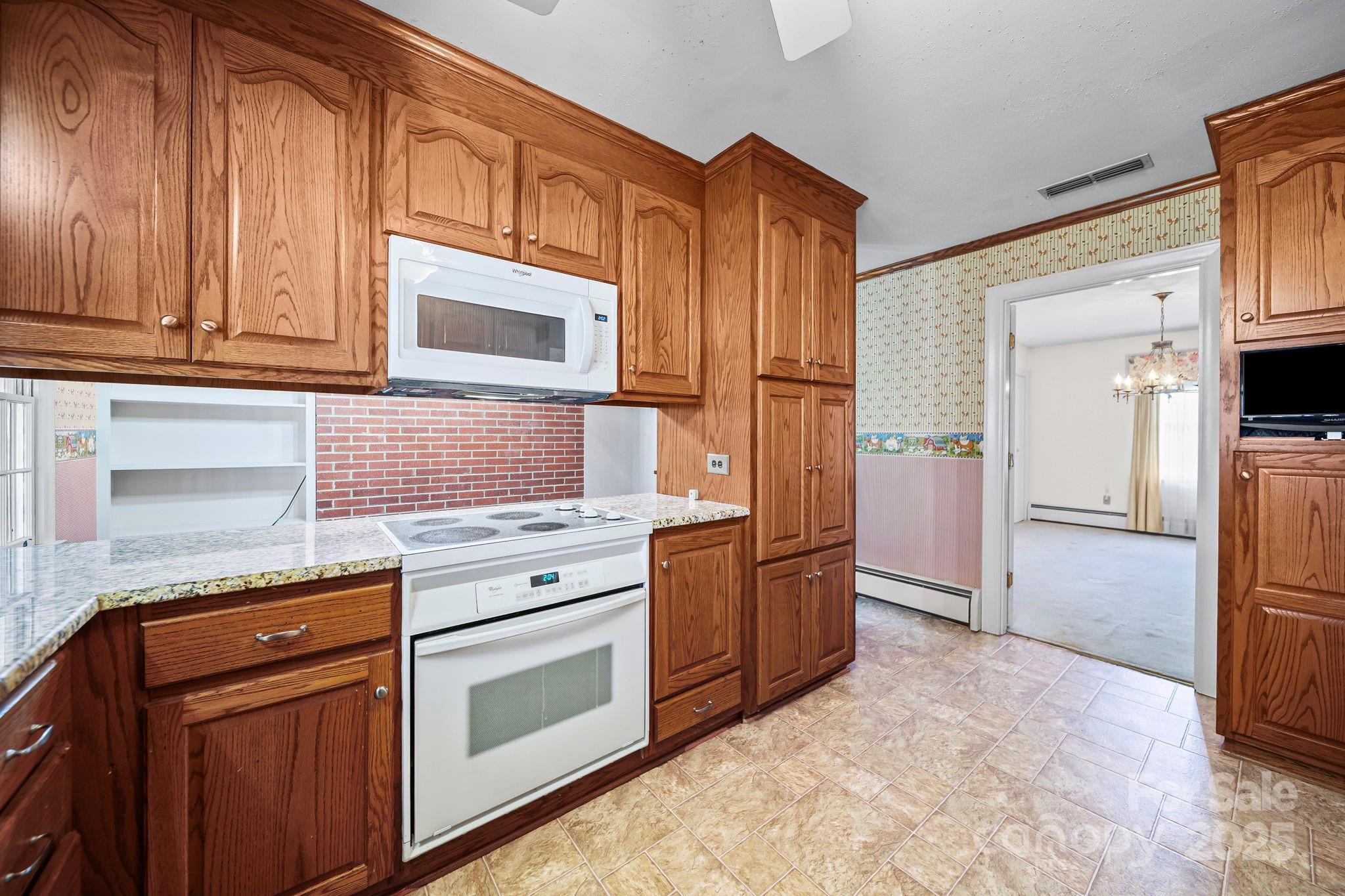 1223 Walker Road Mount Pleasant, NC 28124 - Photo 16 of 48 a kitchen with stainless steel appliances granite countertop a refrigerator stove and sink