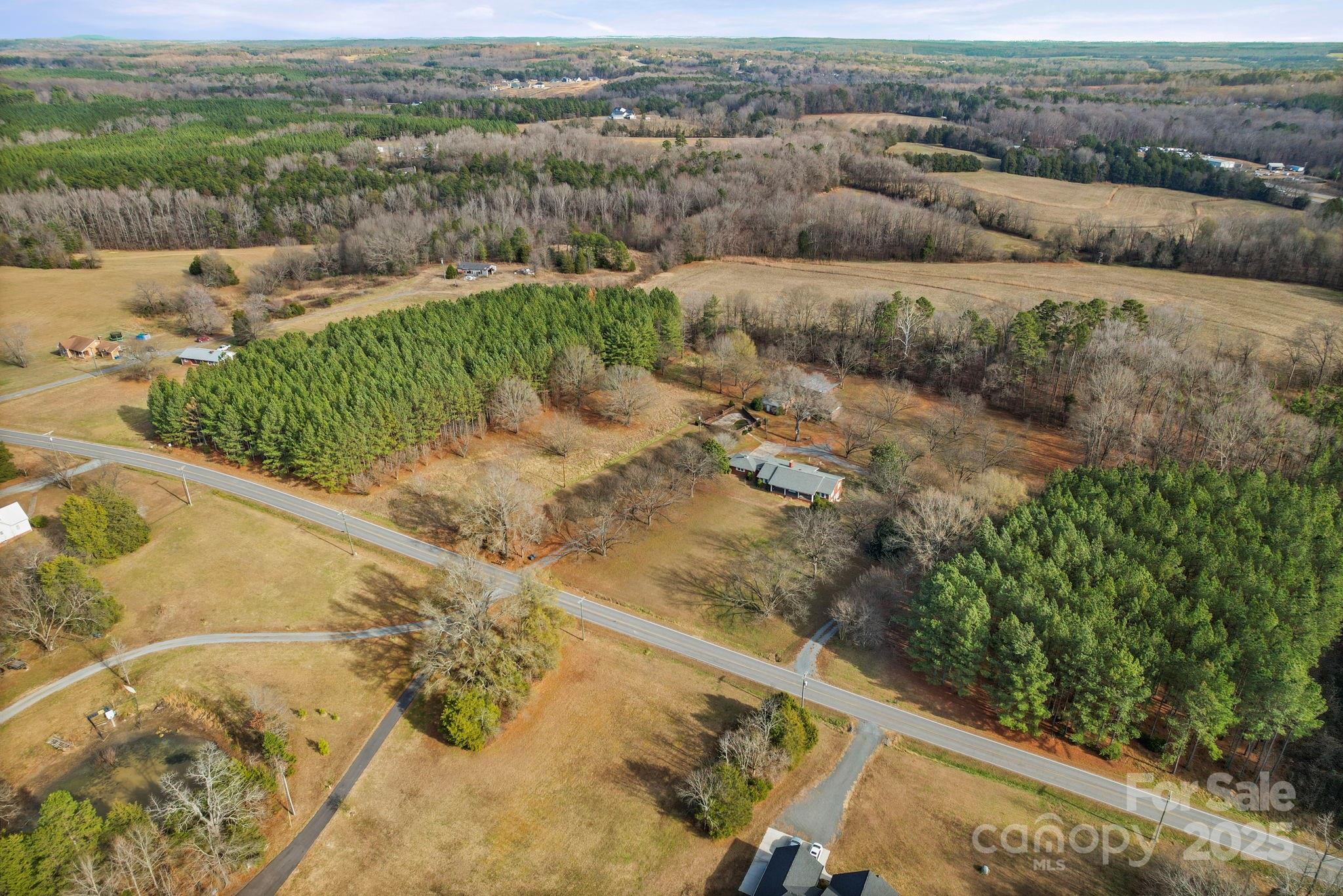 1223 Walker Road Mount Pleasant, NC 28124 - Photo 2 of 48 a view of a yard with wooden fence