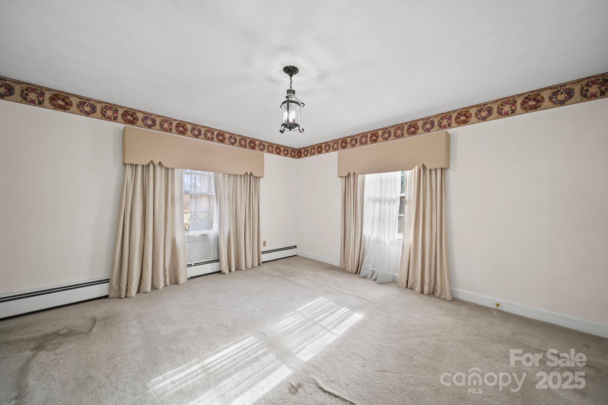 1223 Walker Road Mount Pleasant, NC 28124 - Photo 23 of 48 a view of a livingroom with a ceiling fan and window