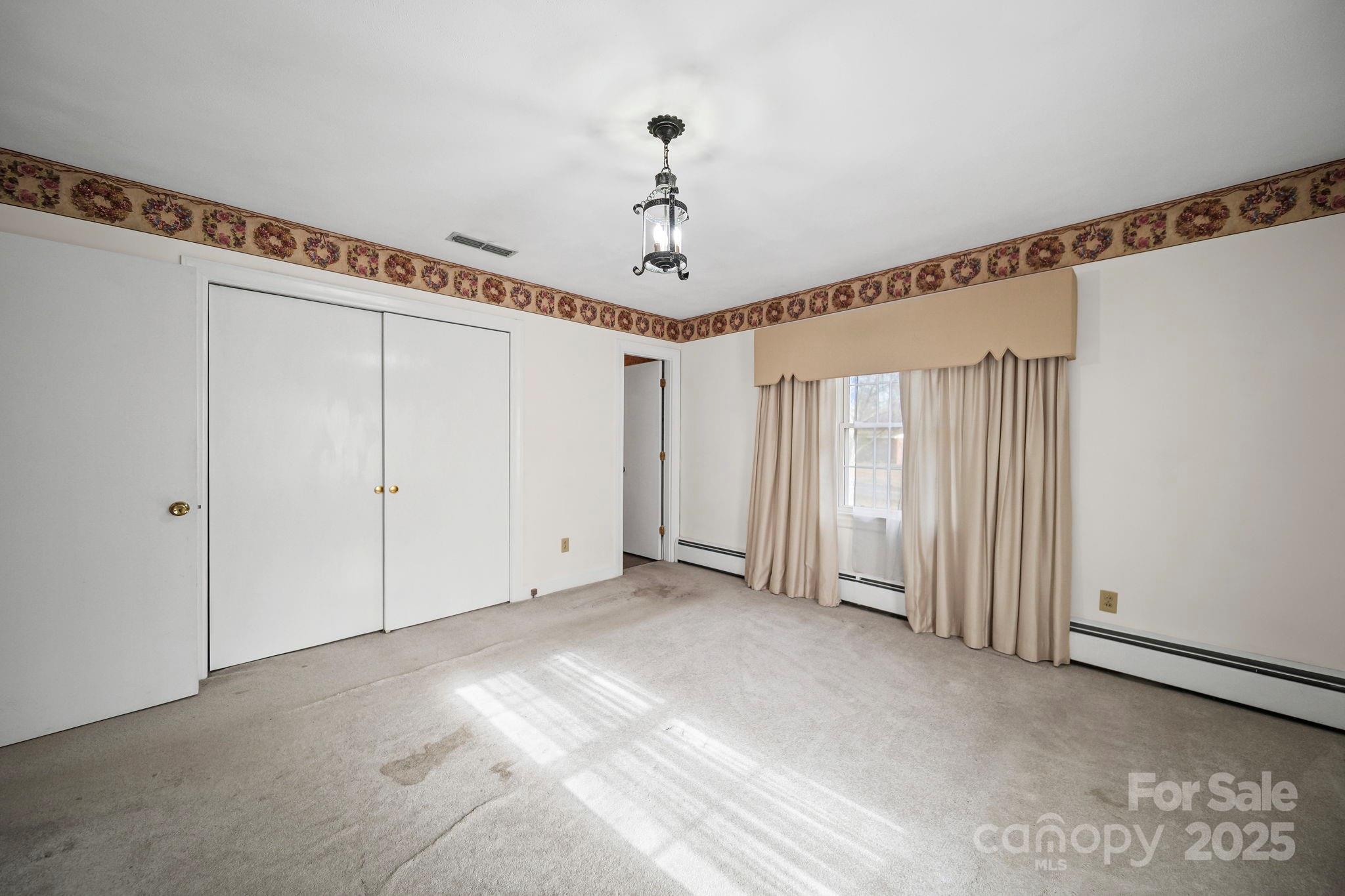 1223 Walker Road Mount Pleasant, NC 28124 - Photo 24 of 48 a view of a livingroom with a chandelier