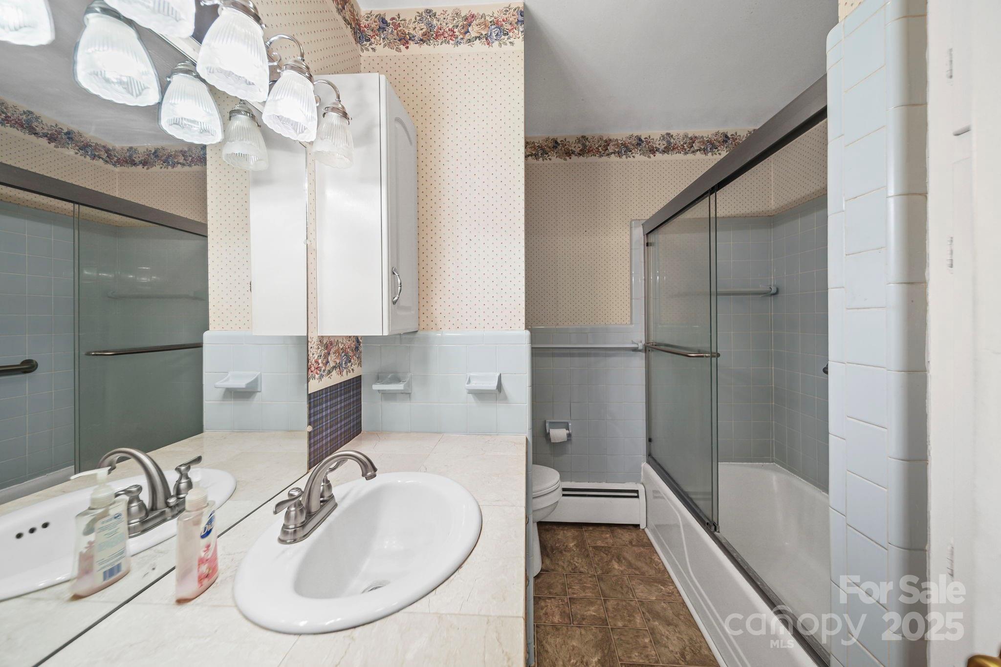 1223 Walker Road Mount Pleasant, NC 28124 - Photo 25 of 48 a bathroom with a sink and a bathtub