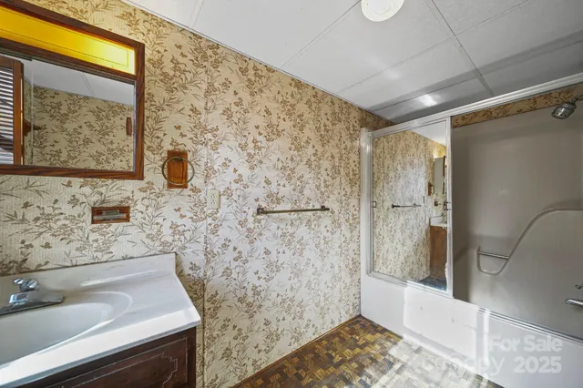 a bathroom with a sink and a shower