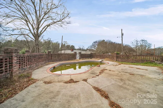 a view of a house with swimming pool