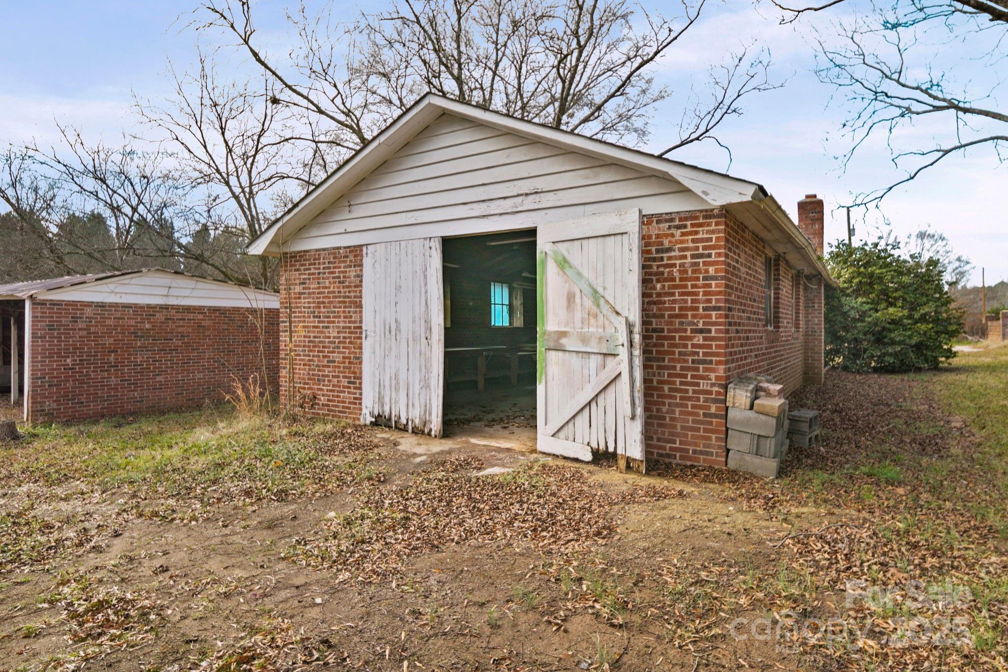 1223 Walker Road Mount Pleasant, NC 28124 - Photo 44 of 48 a view of a house with a yard