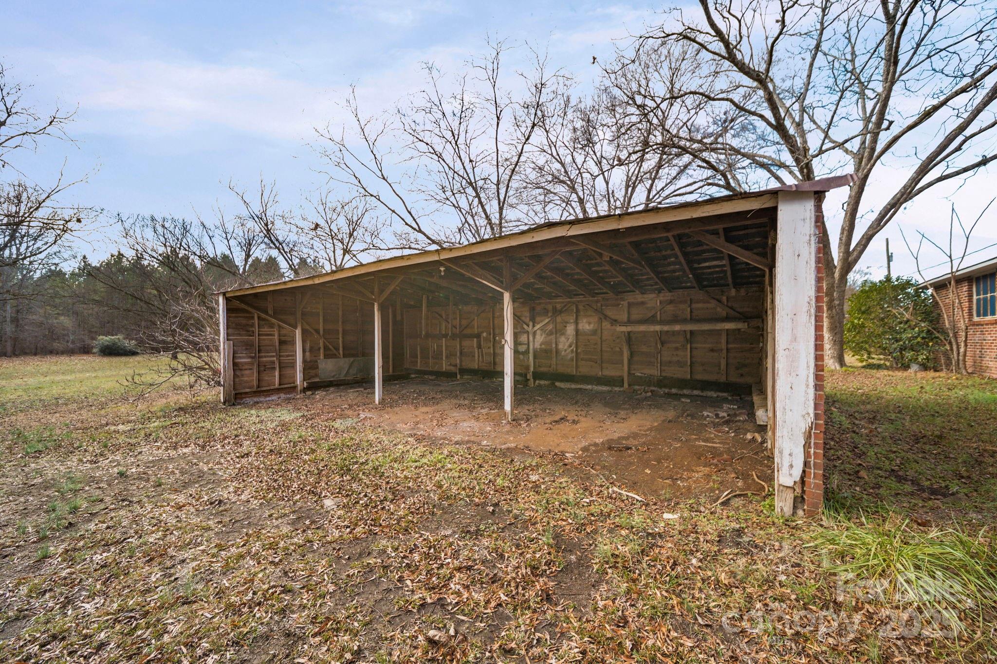 1223 Walker Road Mount Pleasant, NC 28124 - Photo 46 of 48 a view of a house with a yard