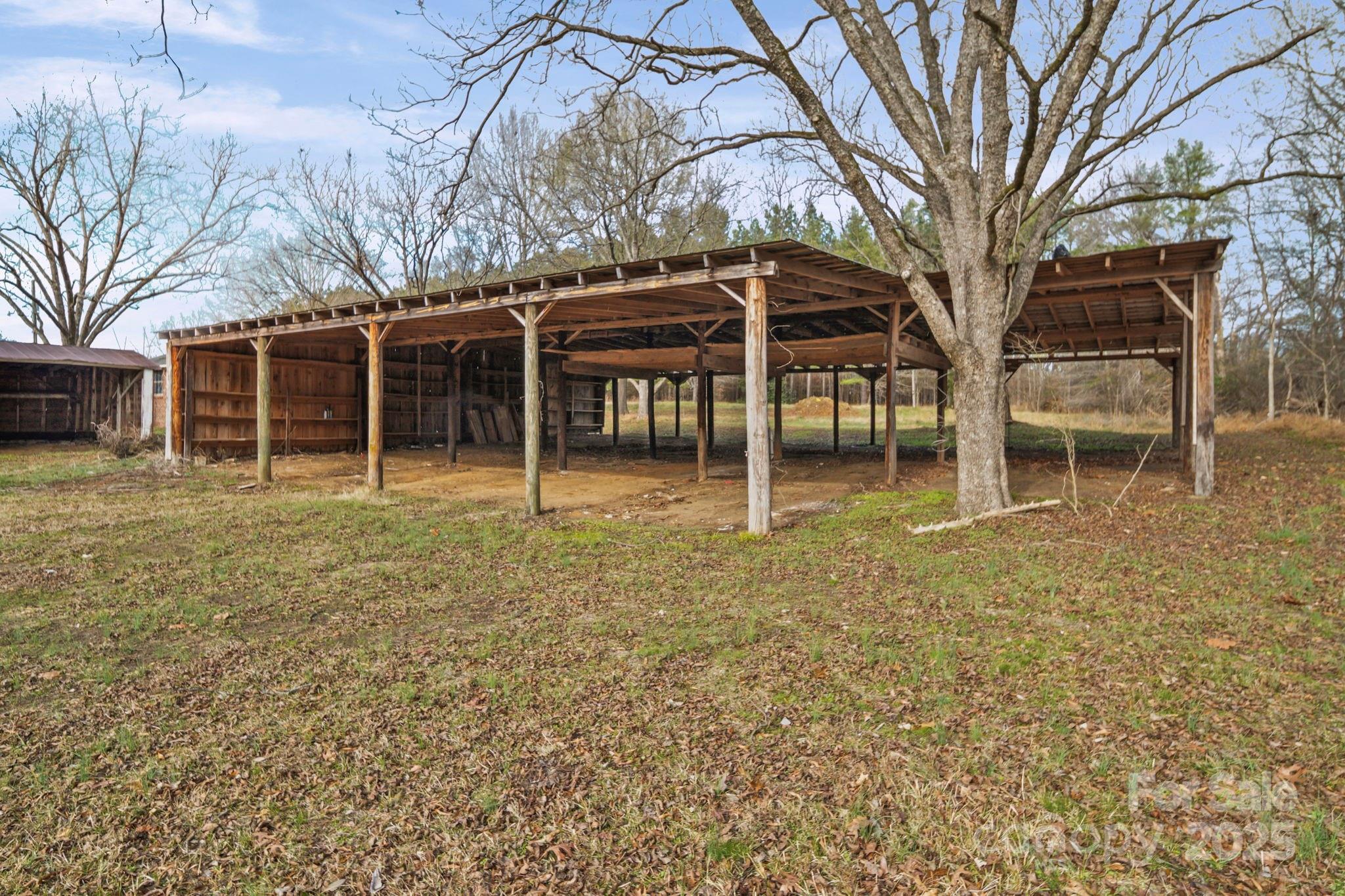 1223 Walker Road Mount Pleasant, NC 28124 - Photo 47 of 48 a house with trees in front of it
