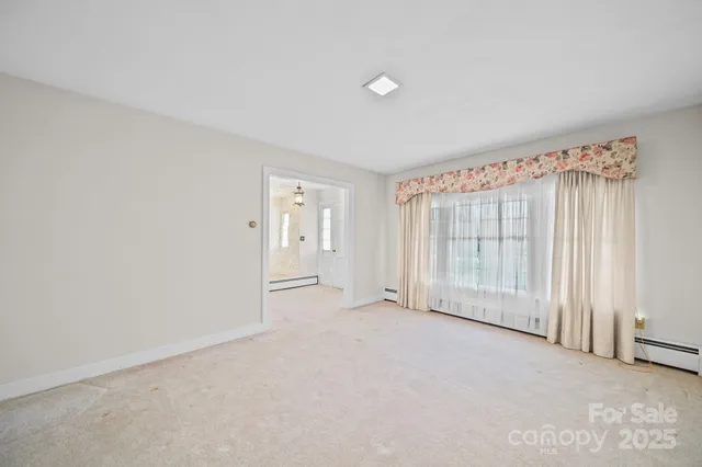 an empty room with a empty space and a window