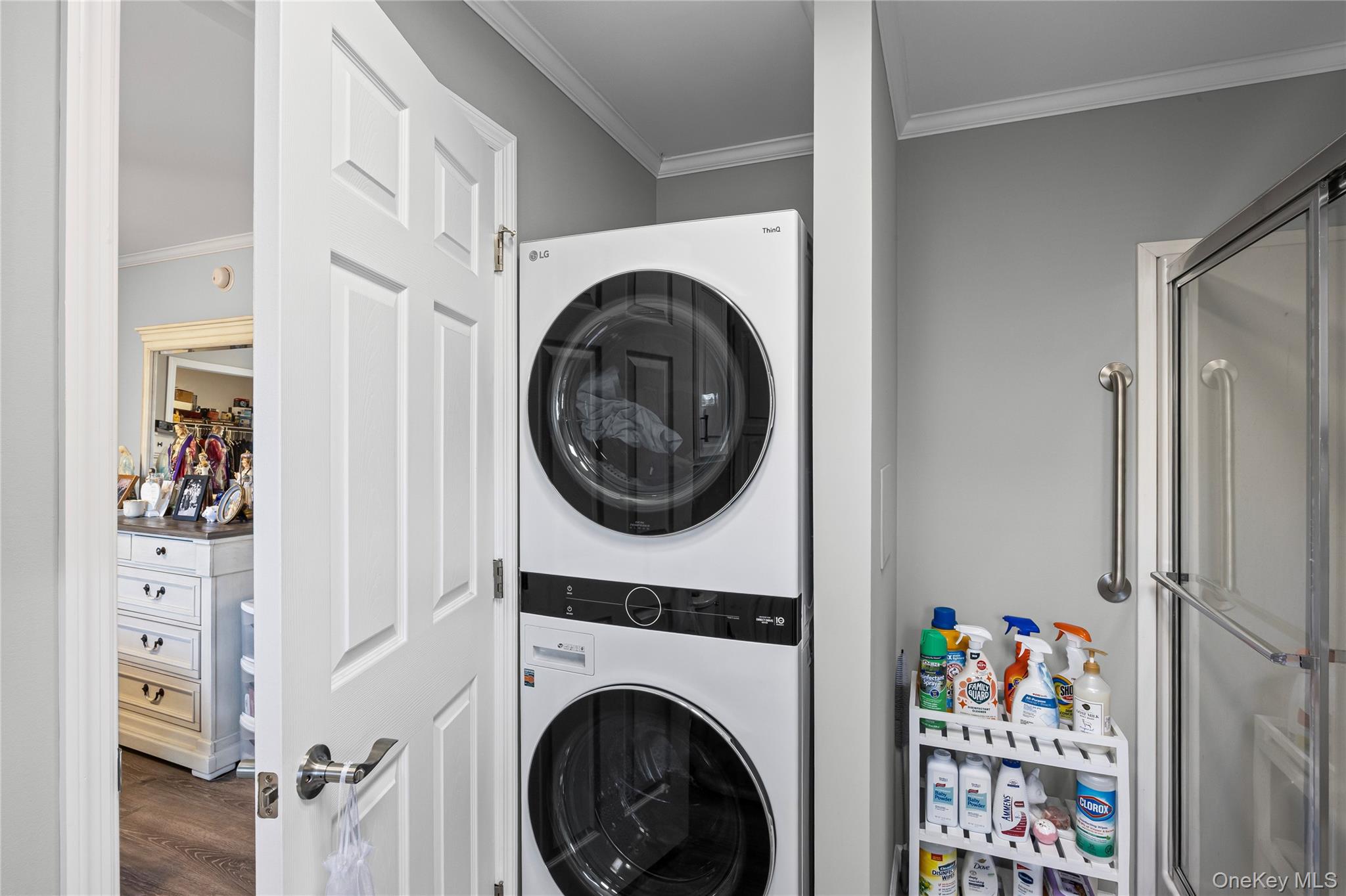 1661 Old Country Road, Unit 351B Riverhead, NY 11901 - Photo 17 of 32 a view of a hallway with washer and dryer