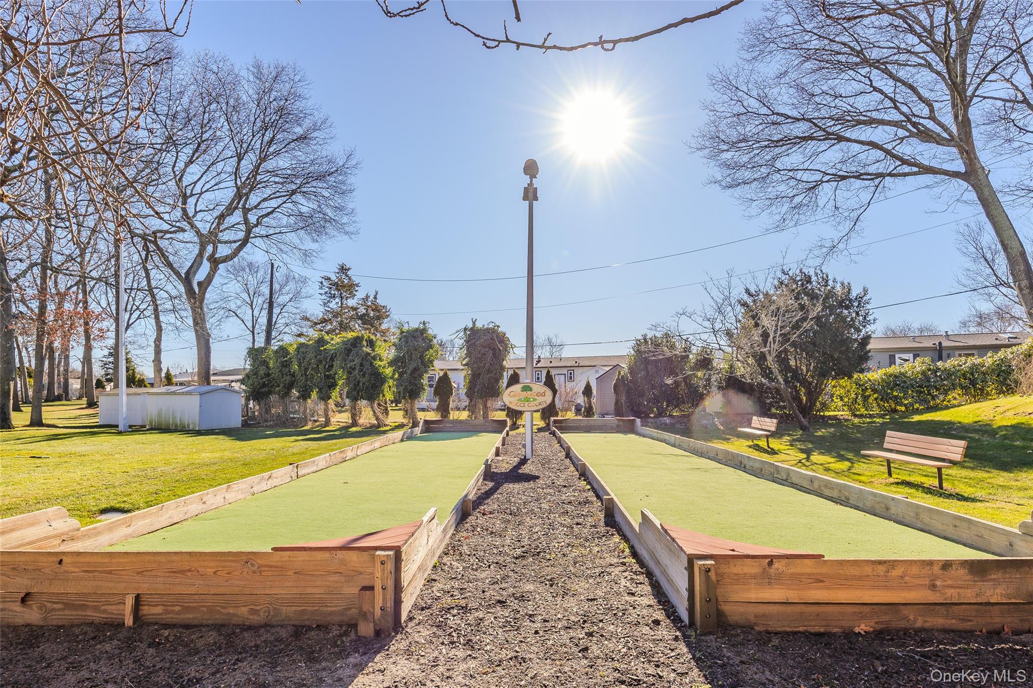 1661 Old Country Road, Unit 351B Riverhead, NY 11901 - Photo 26 of 32 a view of a swimming pool with an outdoor space and seating area