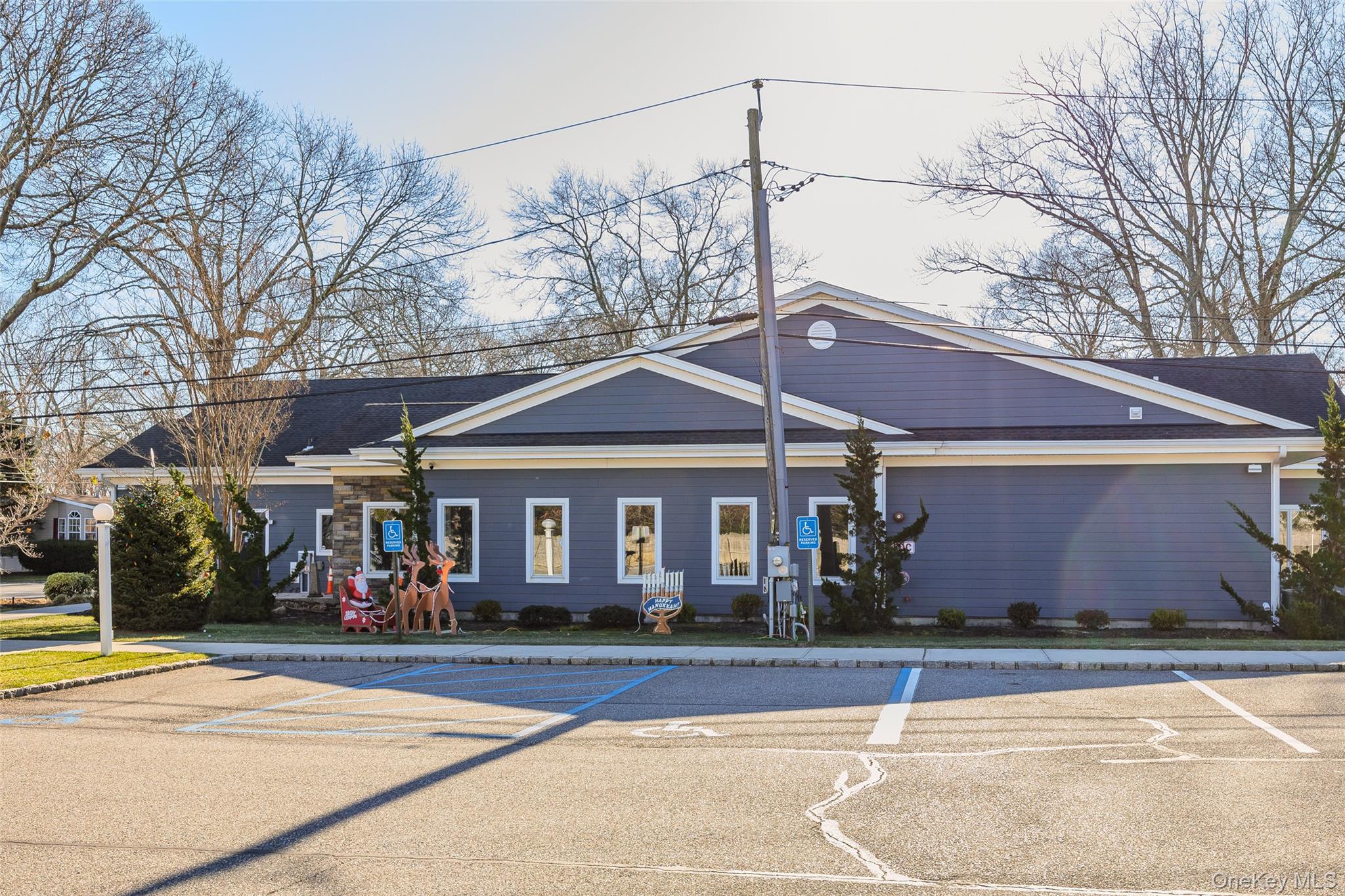 1661 Old Country Road, Unit 351B Riverhead, NY 11901 - Photo 31 of 32 a front view of a house with a space