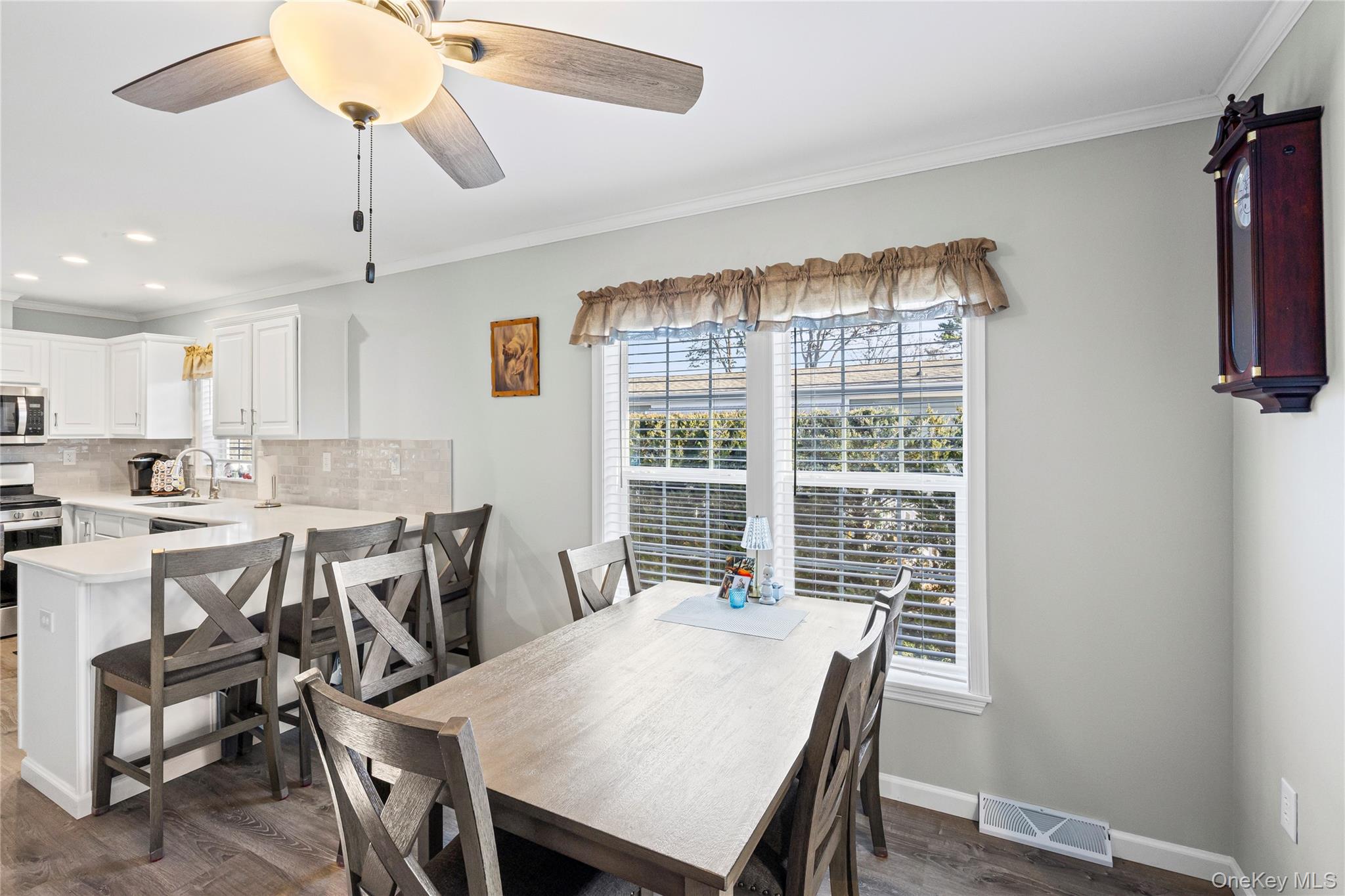 1661 Old Country Road, Unit 351B Riverhead, NY 11901 - Photo 7 of 32 a view of a dining room with furniture window and outside view