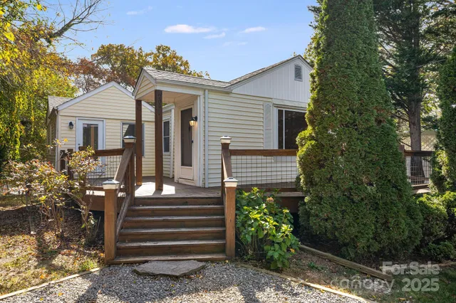 a view of a house with a yard and plants