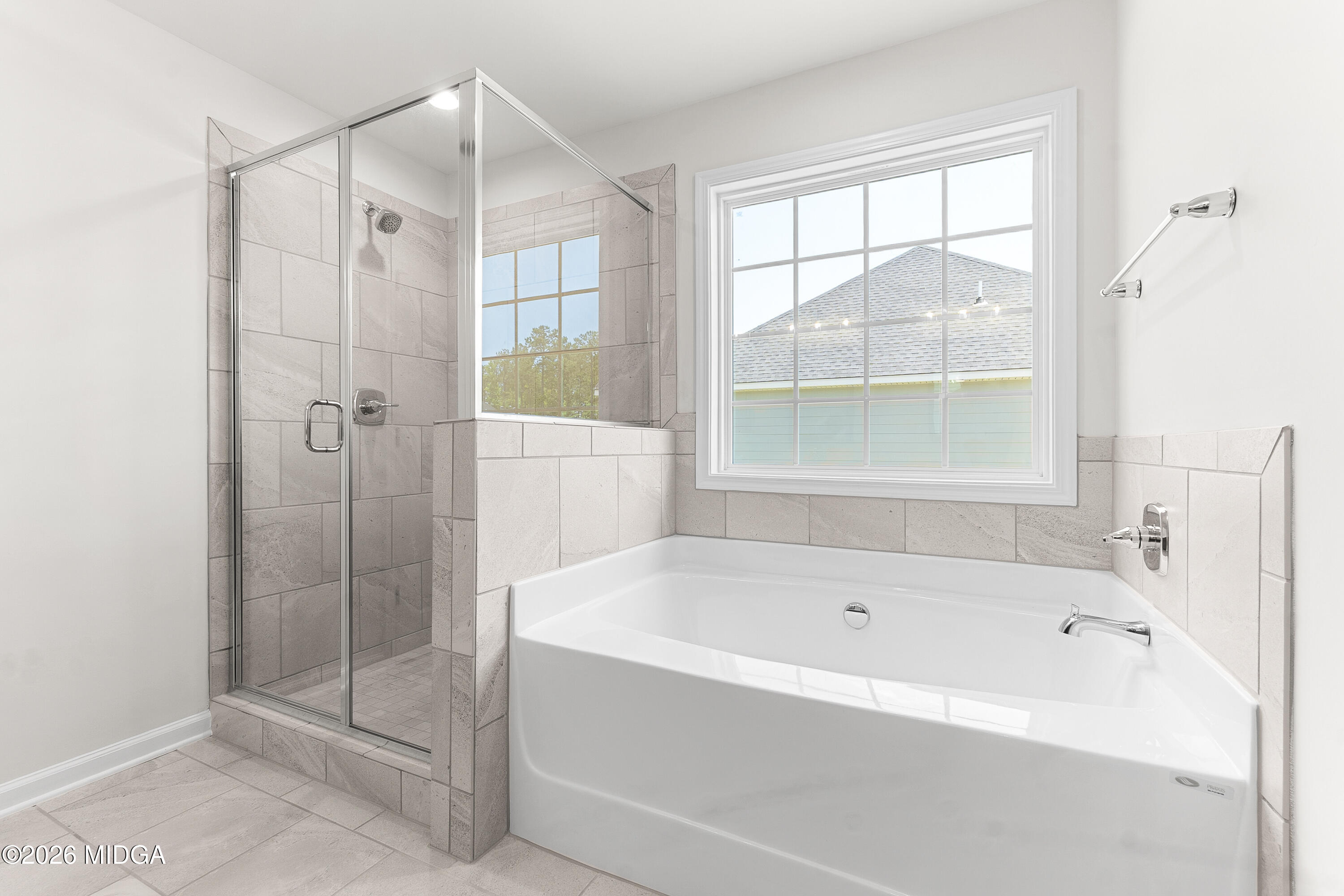 5393 Felles Way, Unit 359 Forsyth, GA 31029 - Photo 34 of 54 a bathroom with a bathtub and shower