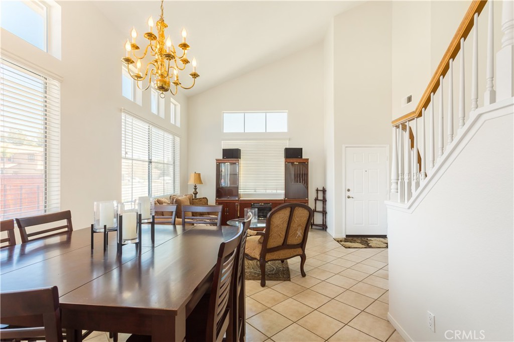 44655 Mill Run Temecula, CA 92592 - Photo 12 of 37 a dining room with furniture a chandelier and wooden floor