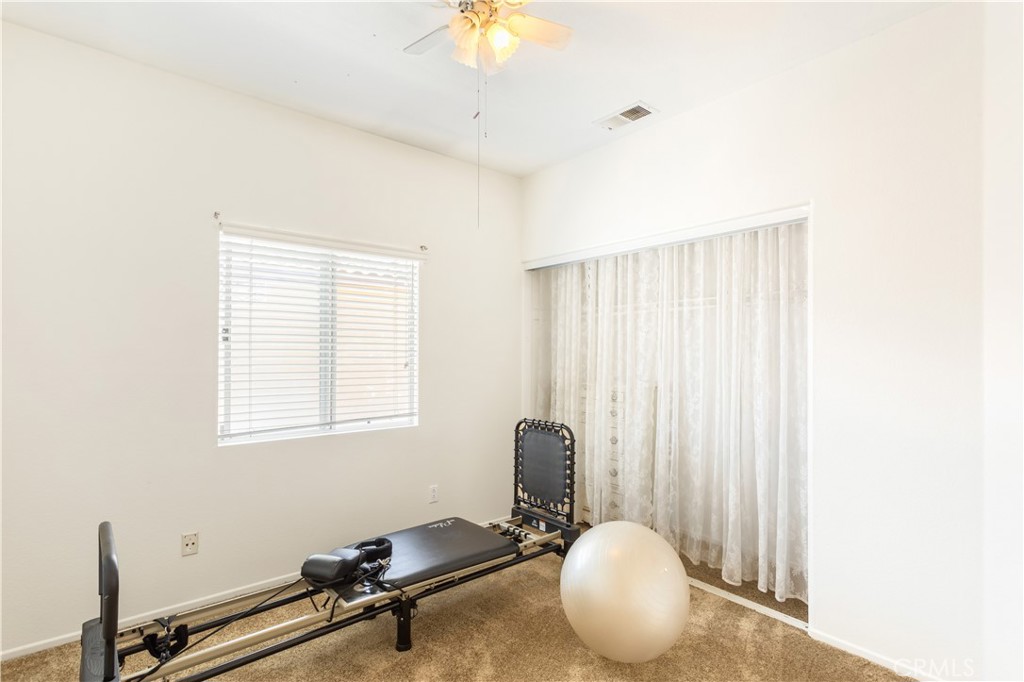 44655 Mill Run Temecula, CA 92592 - Photo 17 of 37 a room with gym equipment and a window