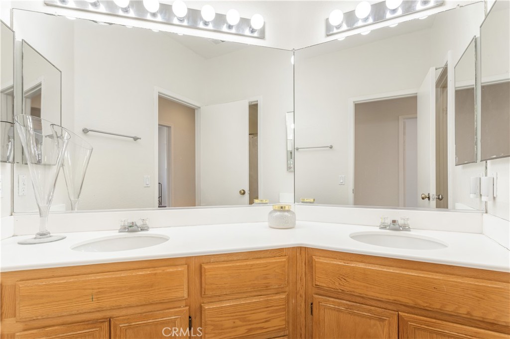 44655 Mill Run Temecula, CA 92592 - Photo 18 of 37 a bathroom with a sink and a mirror