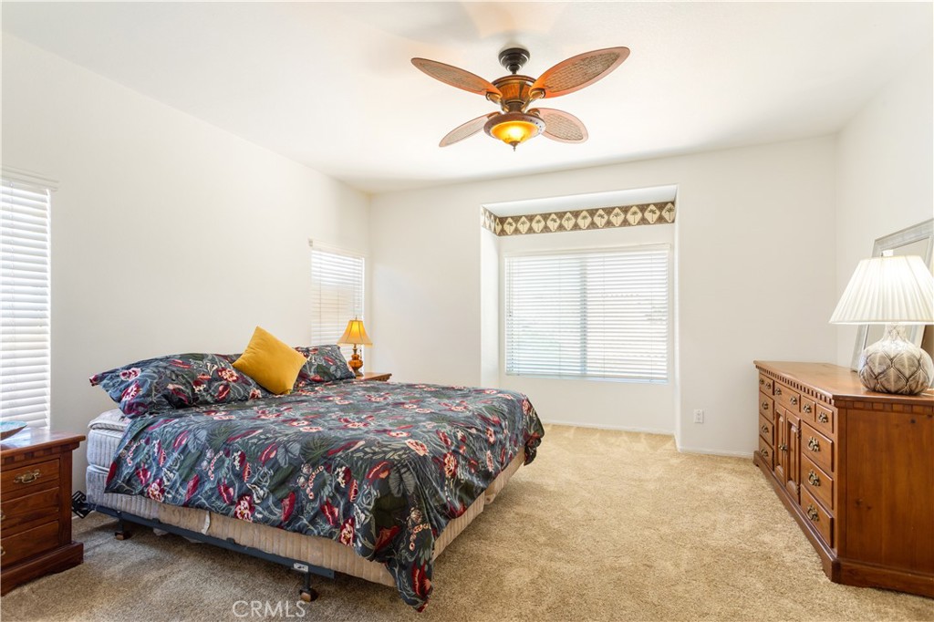 44655 Mill Run Temecula, CA 92592 - Photo 22 of 37 a bedroom with a bed and dresser