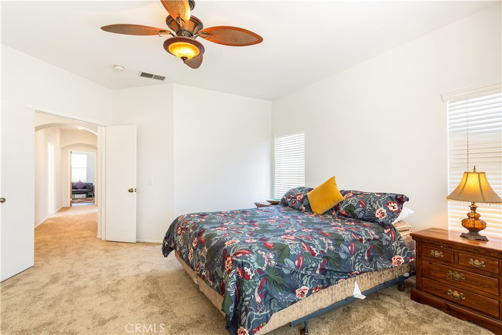 44655 Mill Run Temecula, CA 92592 - Photo 23 of 37 a bedroom with a bed and dresser