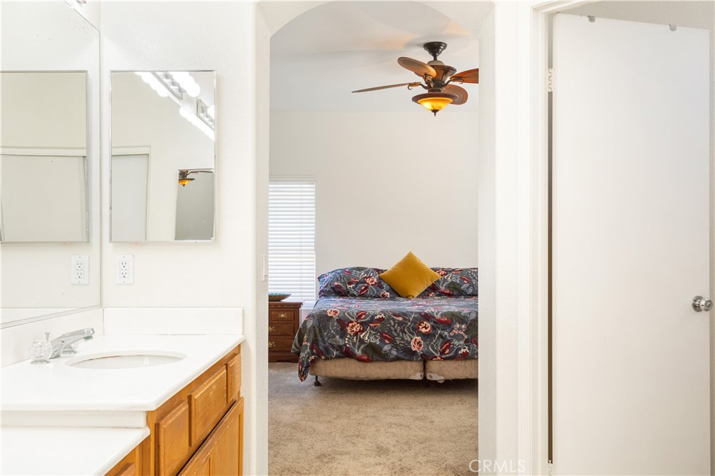 44655 Mill Run Temecula, CA 92592 - Photo 25 of 37 a en suite bathroom with a sink and a mirror