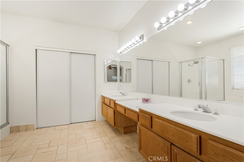 44655 Mill Run Temecula, CA 92592 - Photo 26 of 37 a spacious bathroom with a double vanity sink and a mirror
