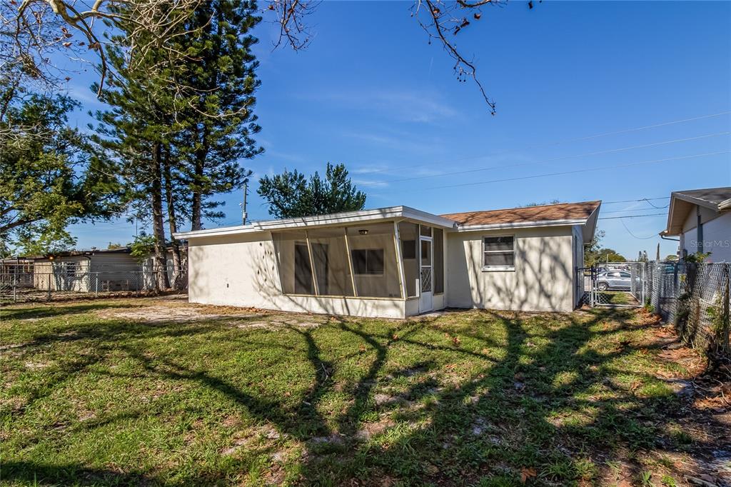 3824 Moog Road Holiday, FL 34691 - Photo 15 of 16 a house view with a garden space