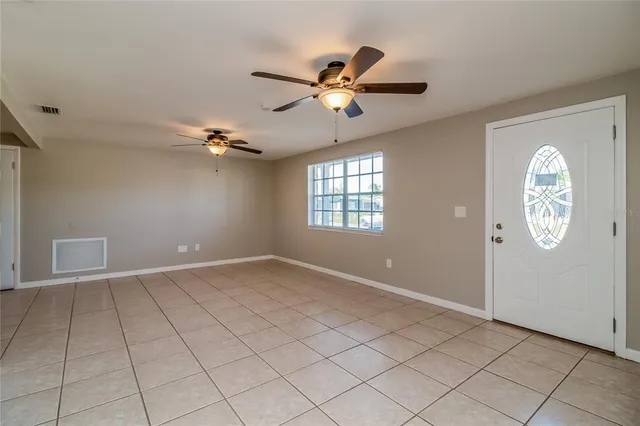 a view of an empty room and window