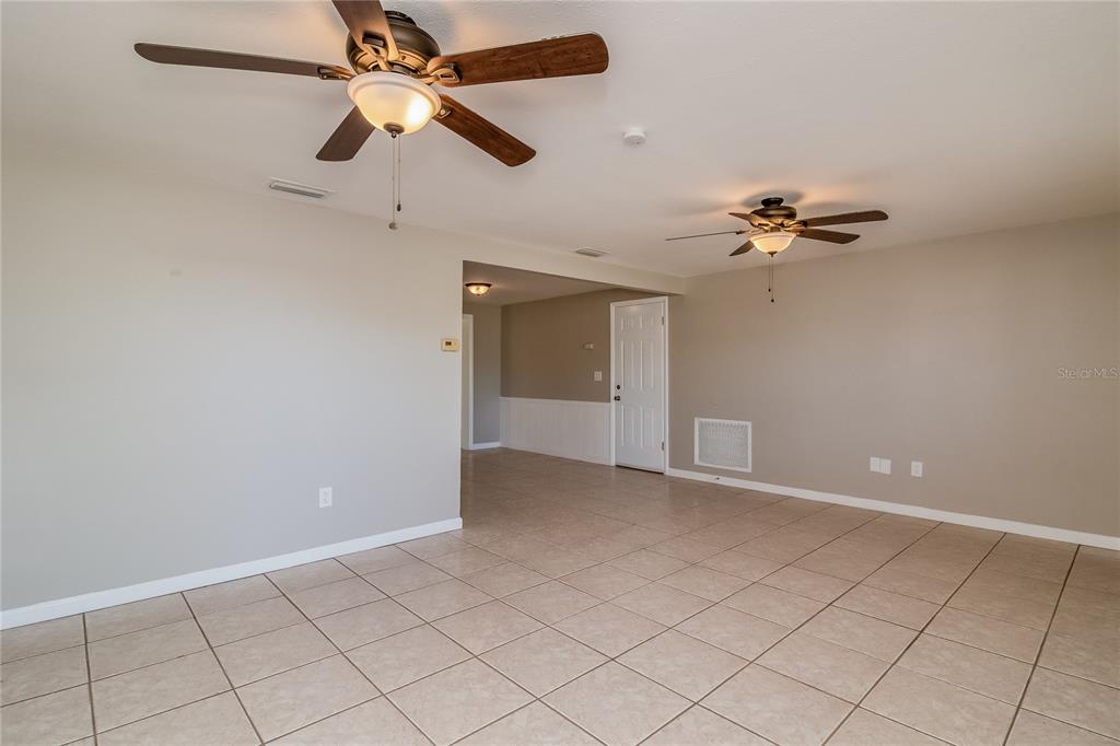 3824 Moog Road Holiday, FL 34691 - Photo 3 of 16 wooden floor in an empty room