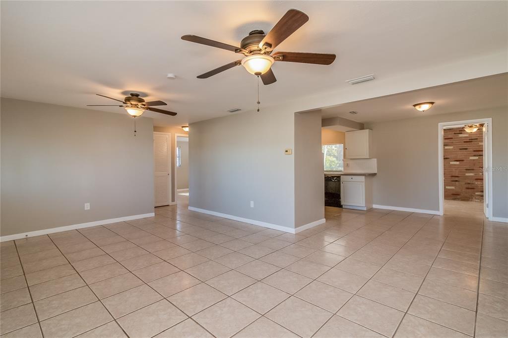 3824 Moog Road Holiday, FL 34691 - Photo 5 of 16 a view of an empty room and a ceiling fan